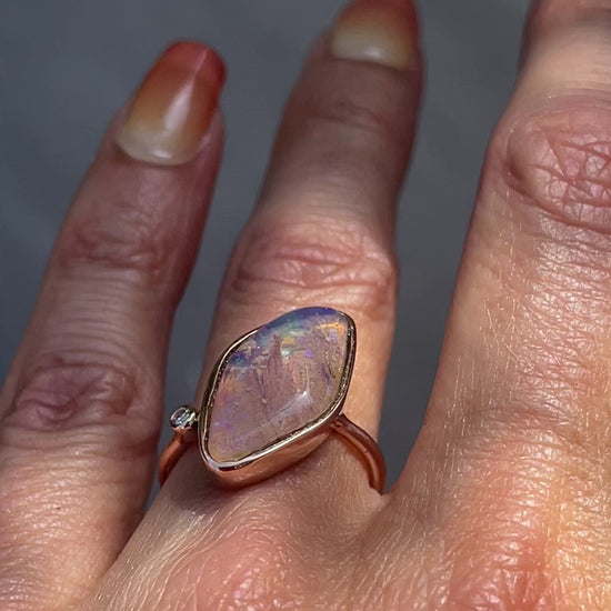 Video of Zion Dali Australian Opal Ring by NIXIN Jewelry modeled on hand. Rose gold opal ring.