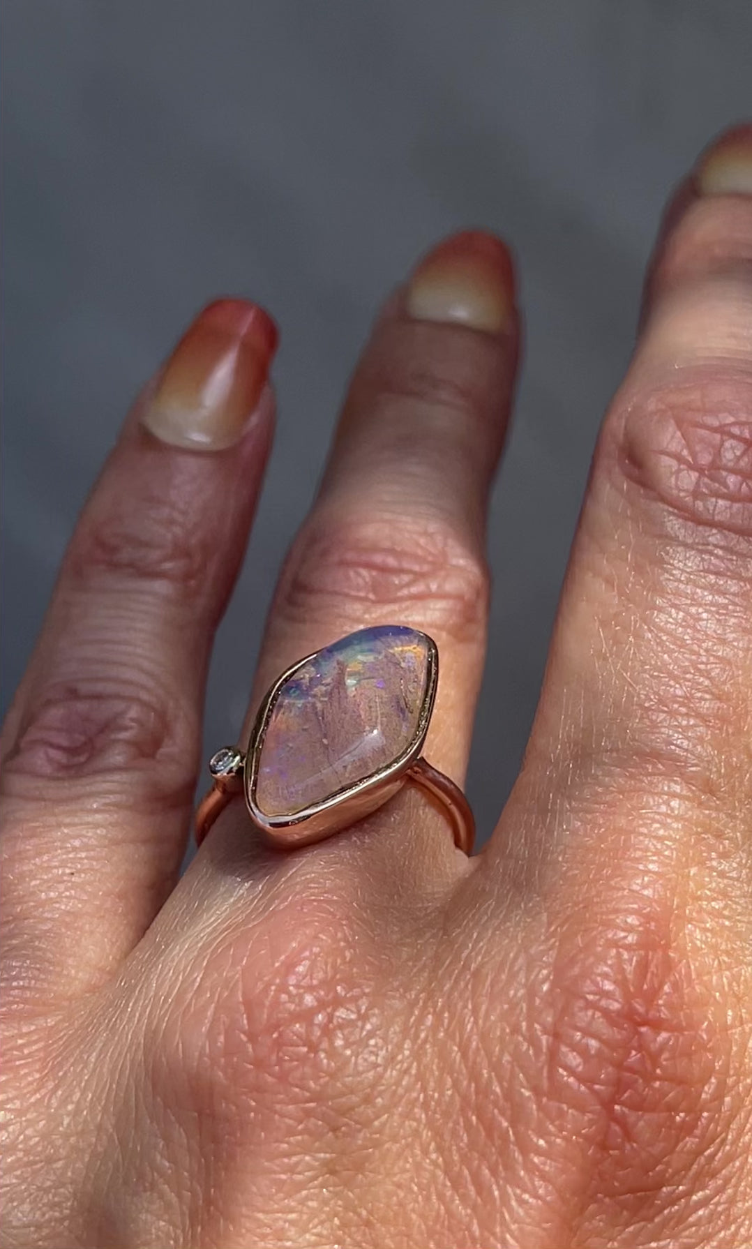 Video of Zion Dali Australian Opal Ring by NIXIN Jewelry modeled on hand. Rose gold opal ring.
