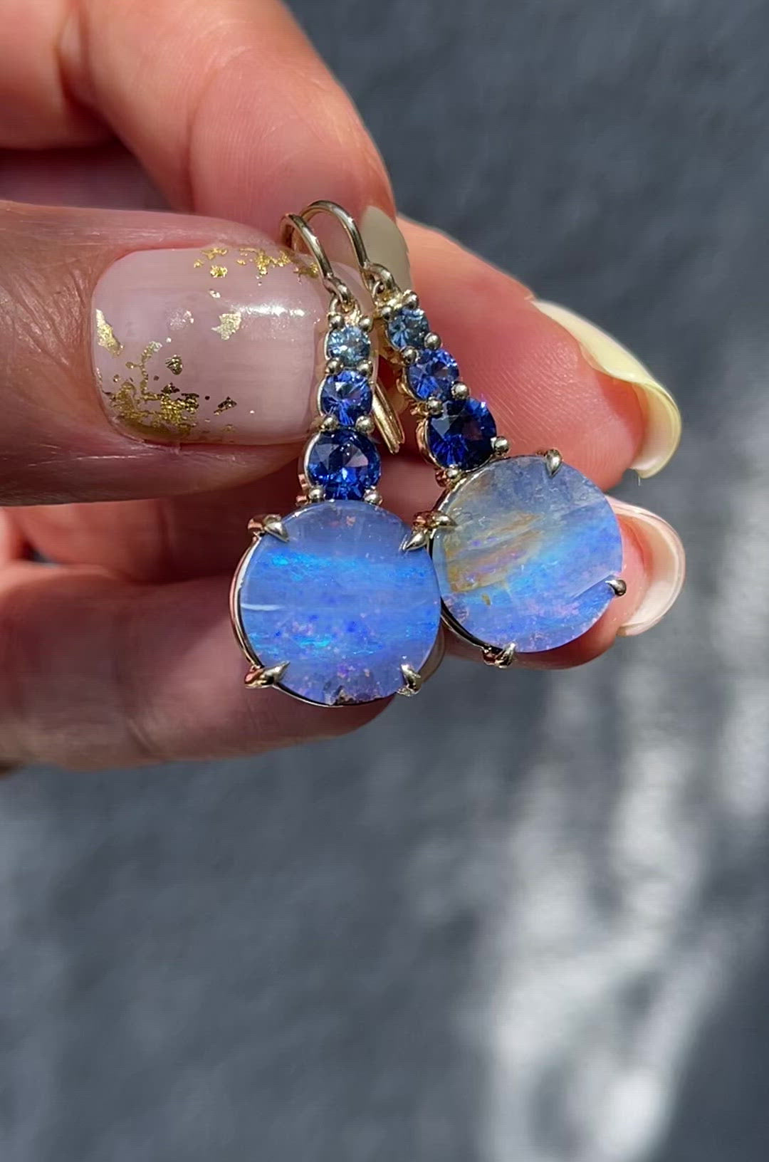 Video of Oceana Australian Opal Earrings by NIXIN Jewelry. Opal dangle earrings with blue sapphire and gold.