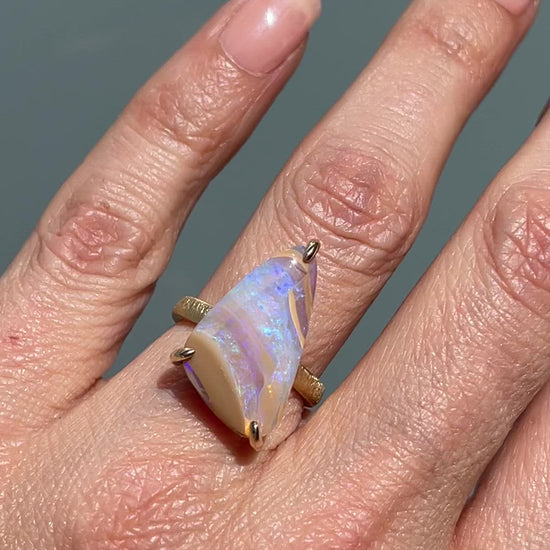 Video of crystal opal ring by NIXIN Jewelry modeled in sunlight