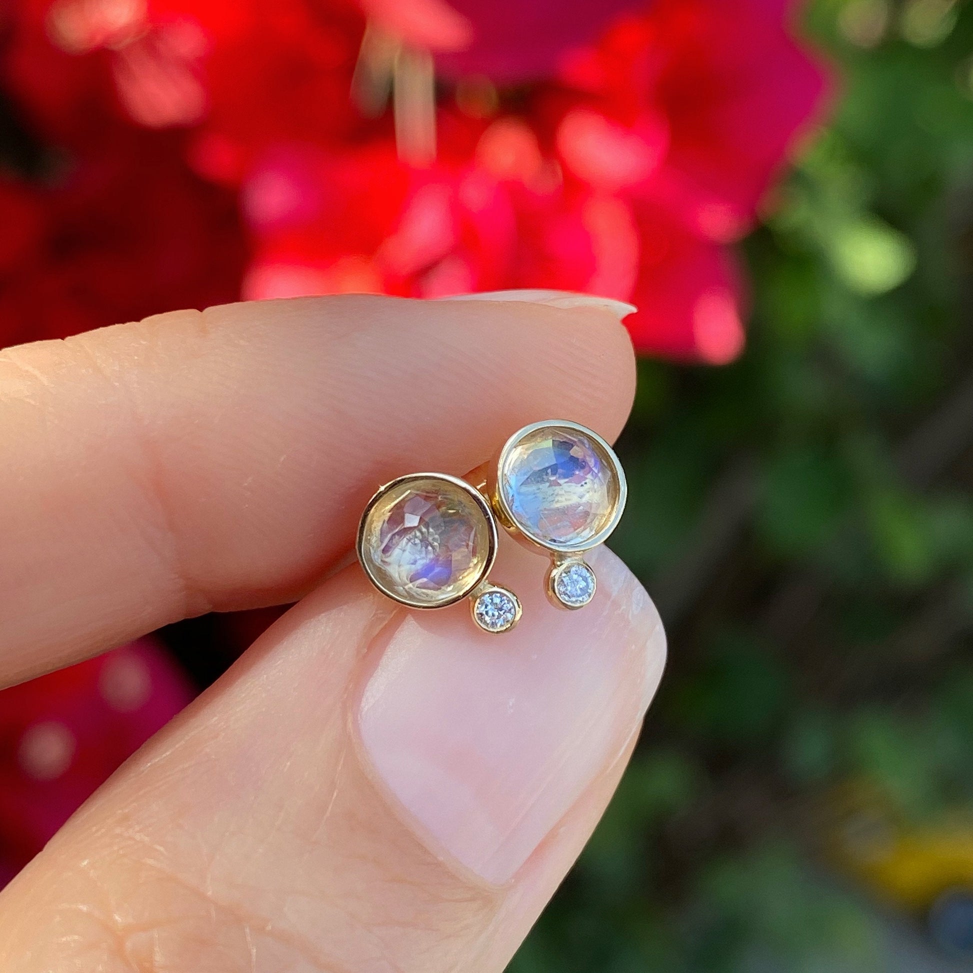 moonbeam moonstone diamond stud earrings in yellow gold with flower backdrop