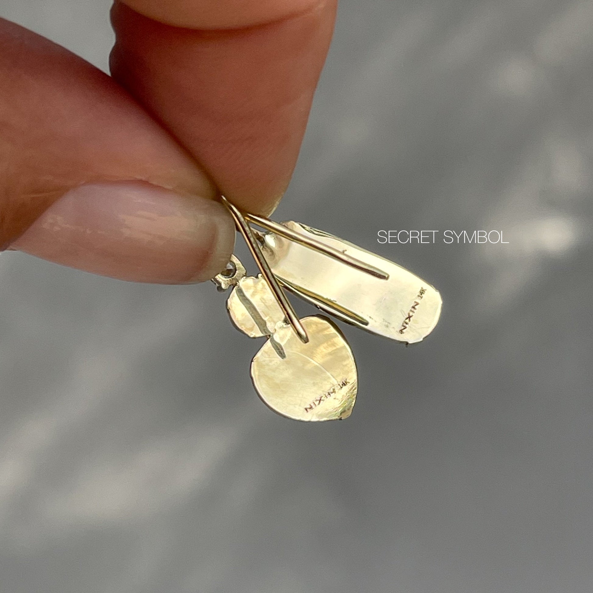 Back view of gold opal earrings by NIXIN Jewelry