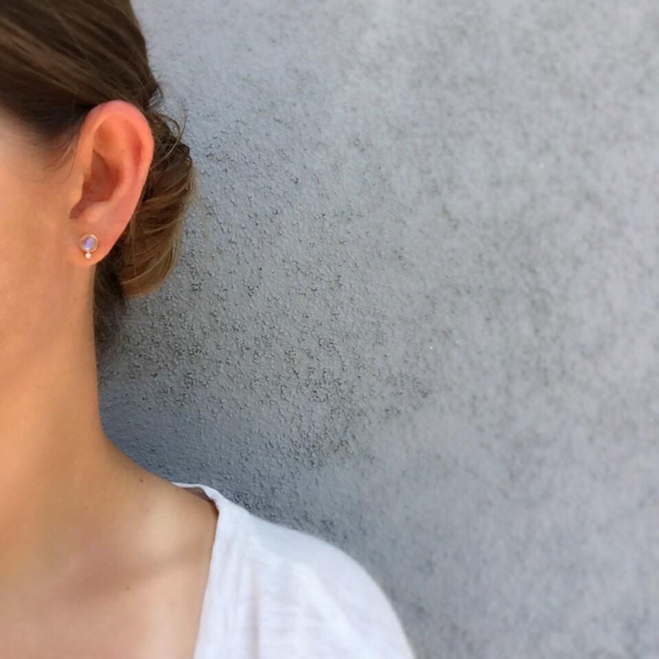 moonbeam moonstone diamond stud earrings in rose gold on model's ear