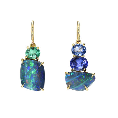 Australian Opal Earrings by NIXIN Jewelry in front of a white backdrop. Made in 14k gold with opals, emerald, sapphire and tanzanite.