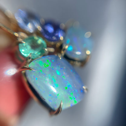 Australian Opal Earrings by NIXIN Jewelry shown up close under a jeweler's loupe. Blue green opal earrings.