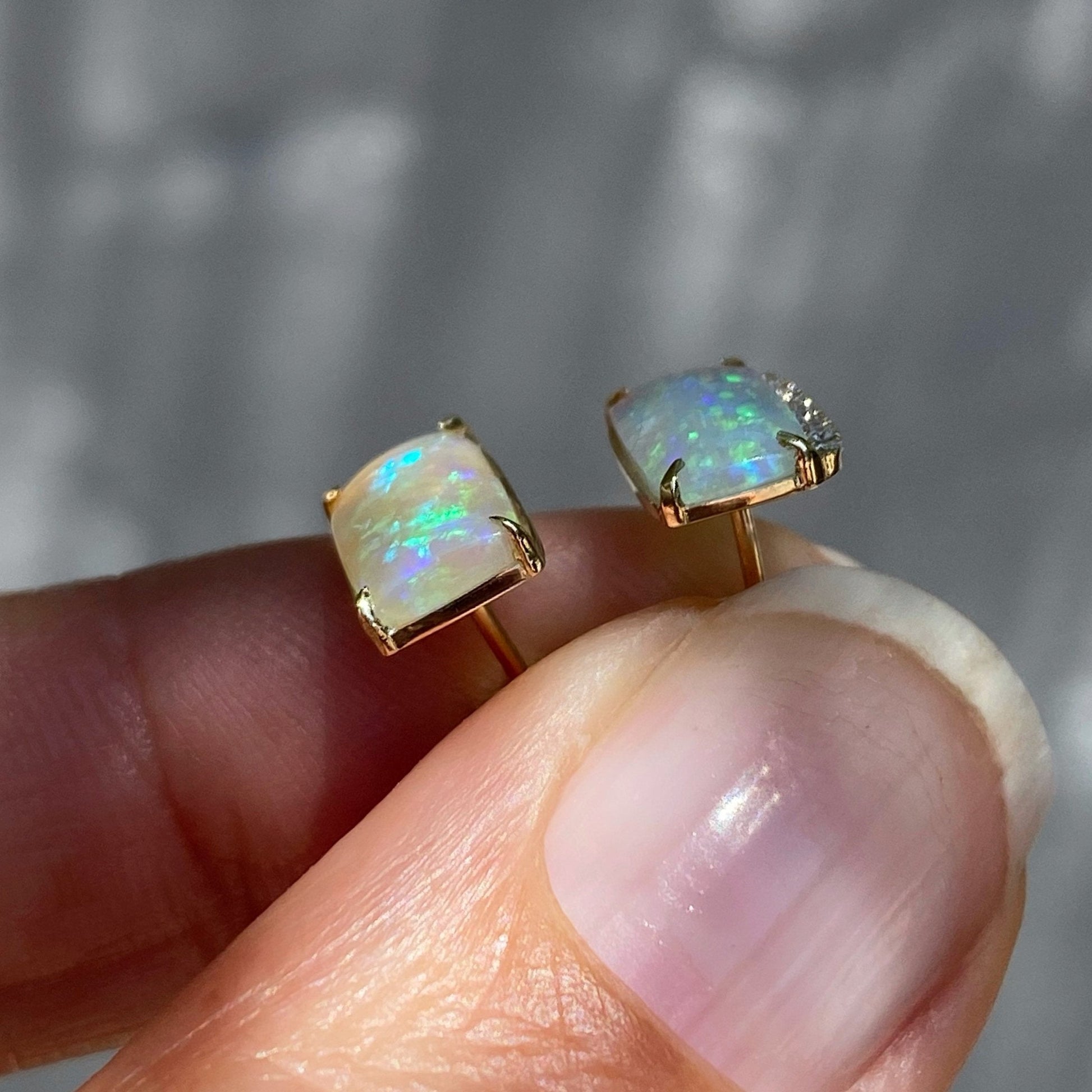Side view of opal earrings gold by NIXIN Jewelry