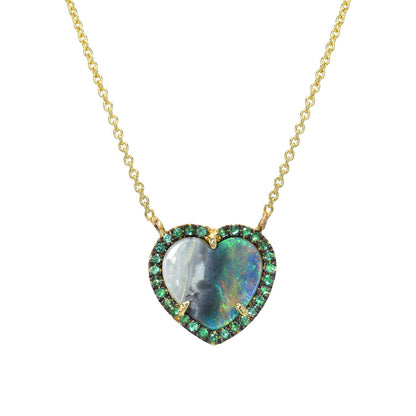 An Australian Opal Heart Necklace by NIXIN Jewelry in front of a white backdrop.