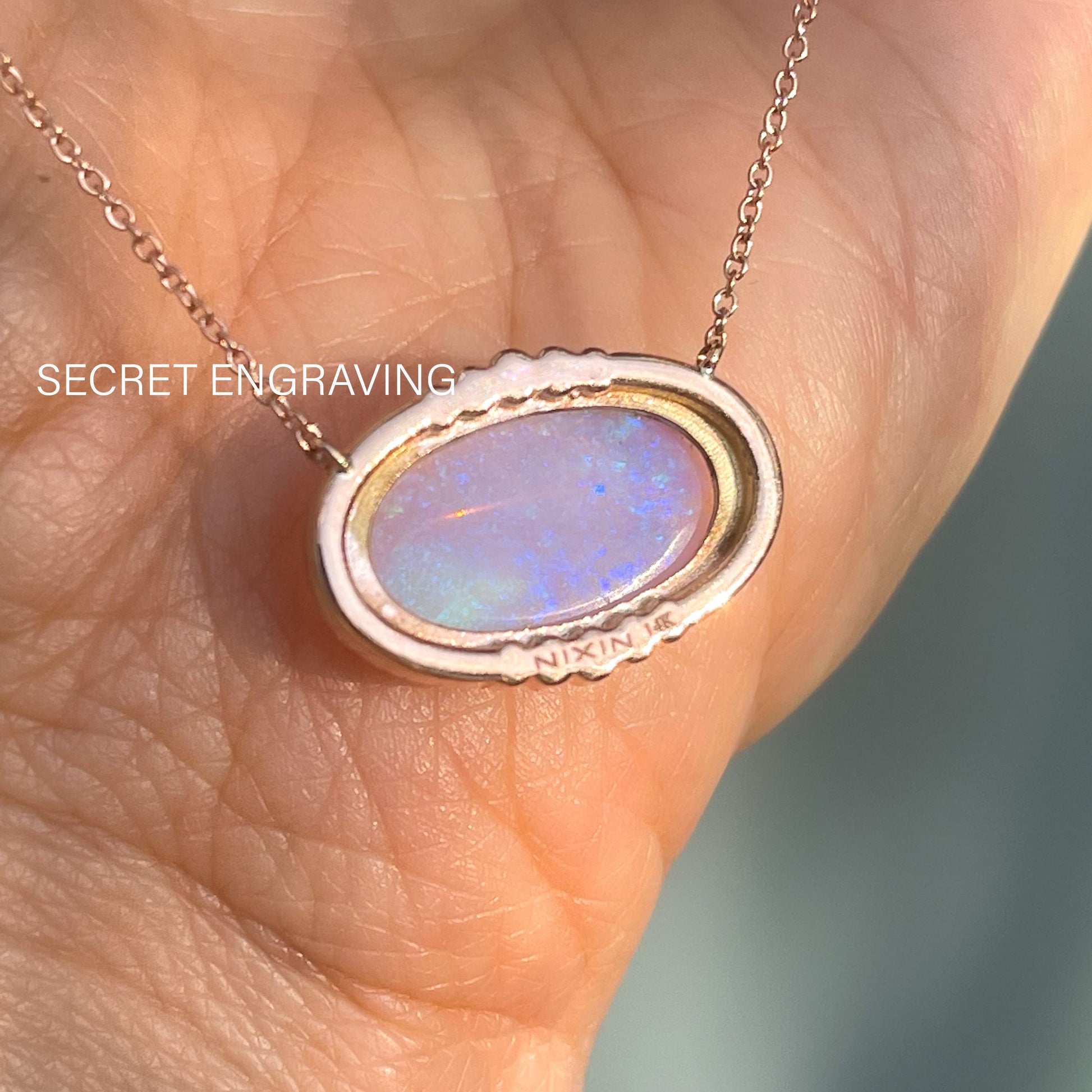  The back of an Australian Opal Necklace by NIXIN Jewelry showing the location of the secret engraving.