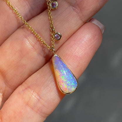 Australian Opal Necklace by NIXIN Jewelry resting on hand. Crystal opal necklace.