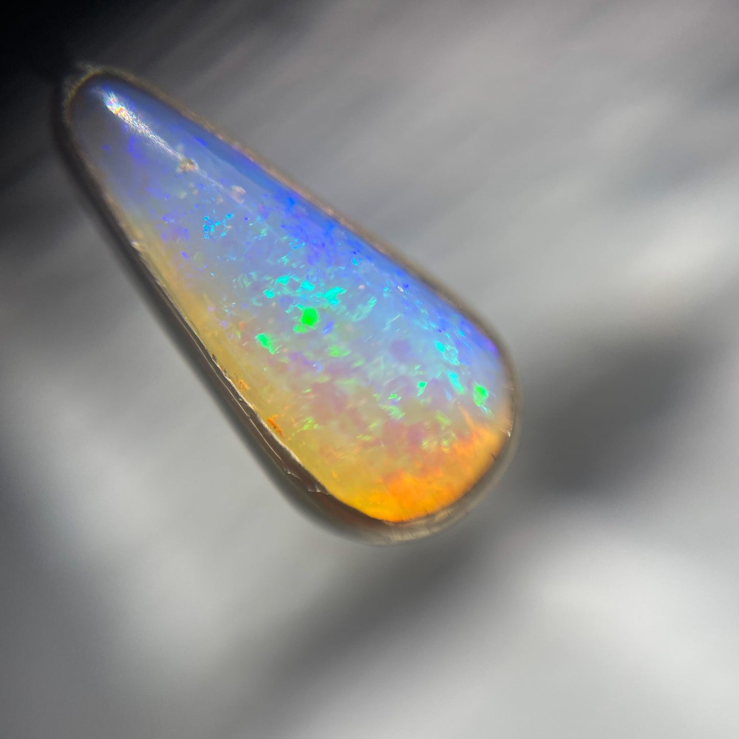 Australian Opal Necklace by NIXIN Jewelry shown under magnification. Real opal necklace.