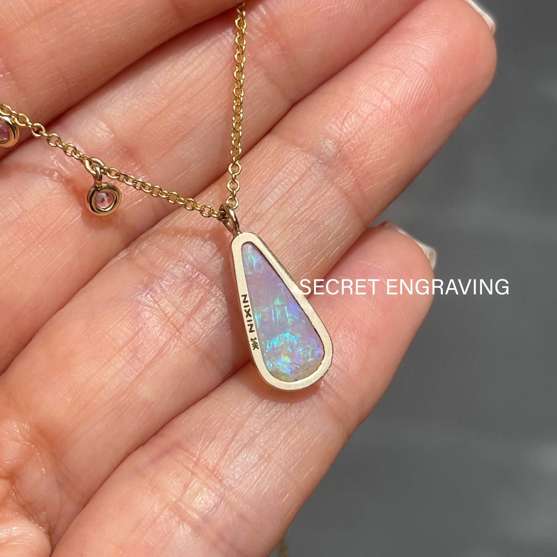 Back of Australian Opal Necklace by NIXIN Jewelry. Photo shows where secret engraving is.