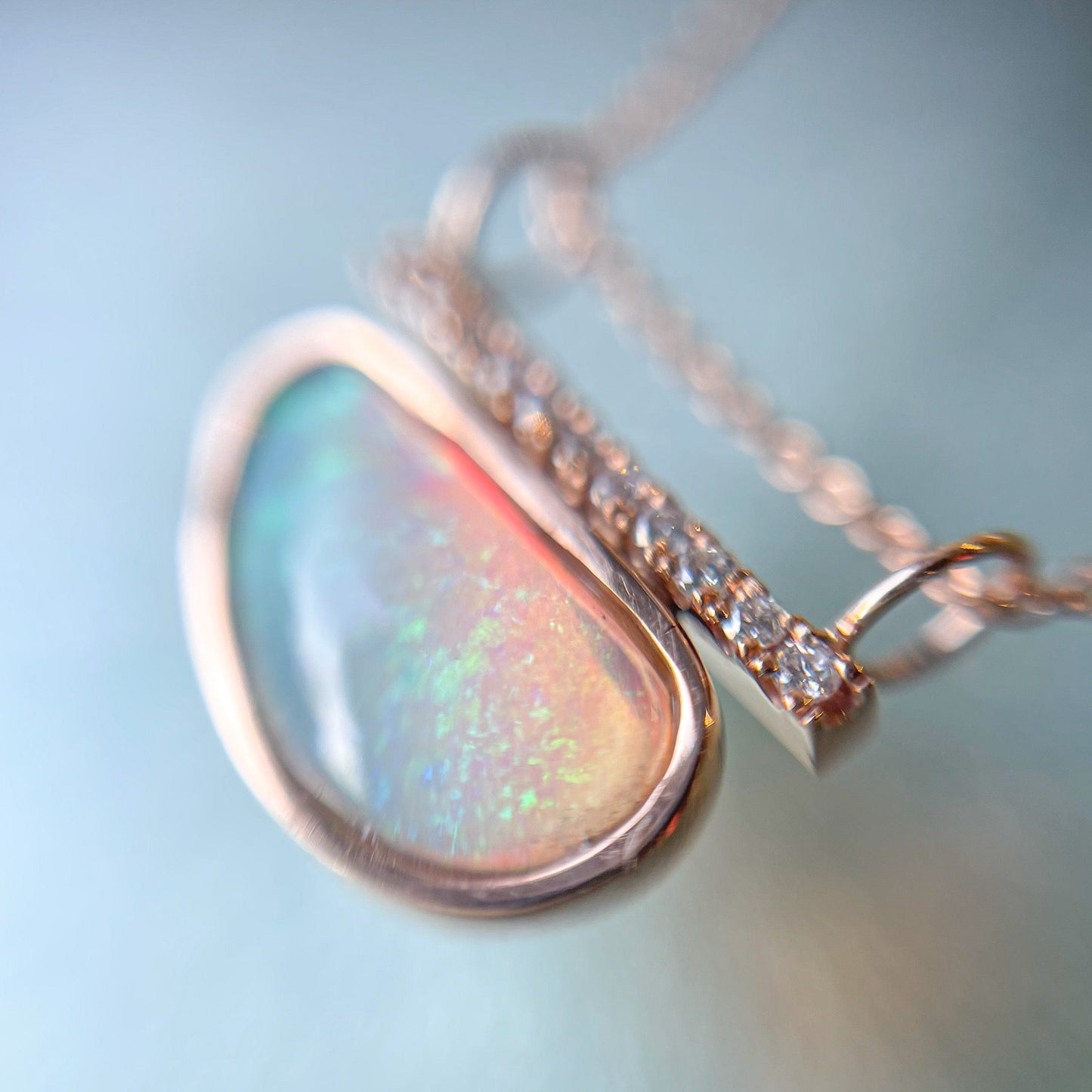 Opal and diamond necklace by NIXIN Jewelry shot close up