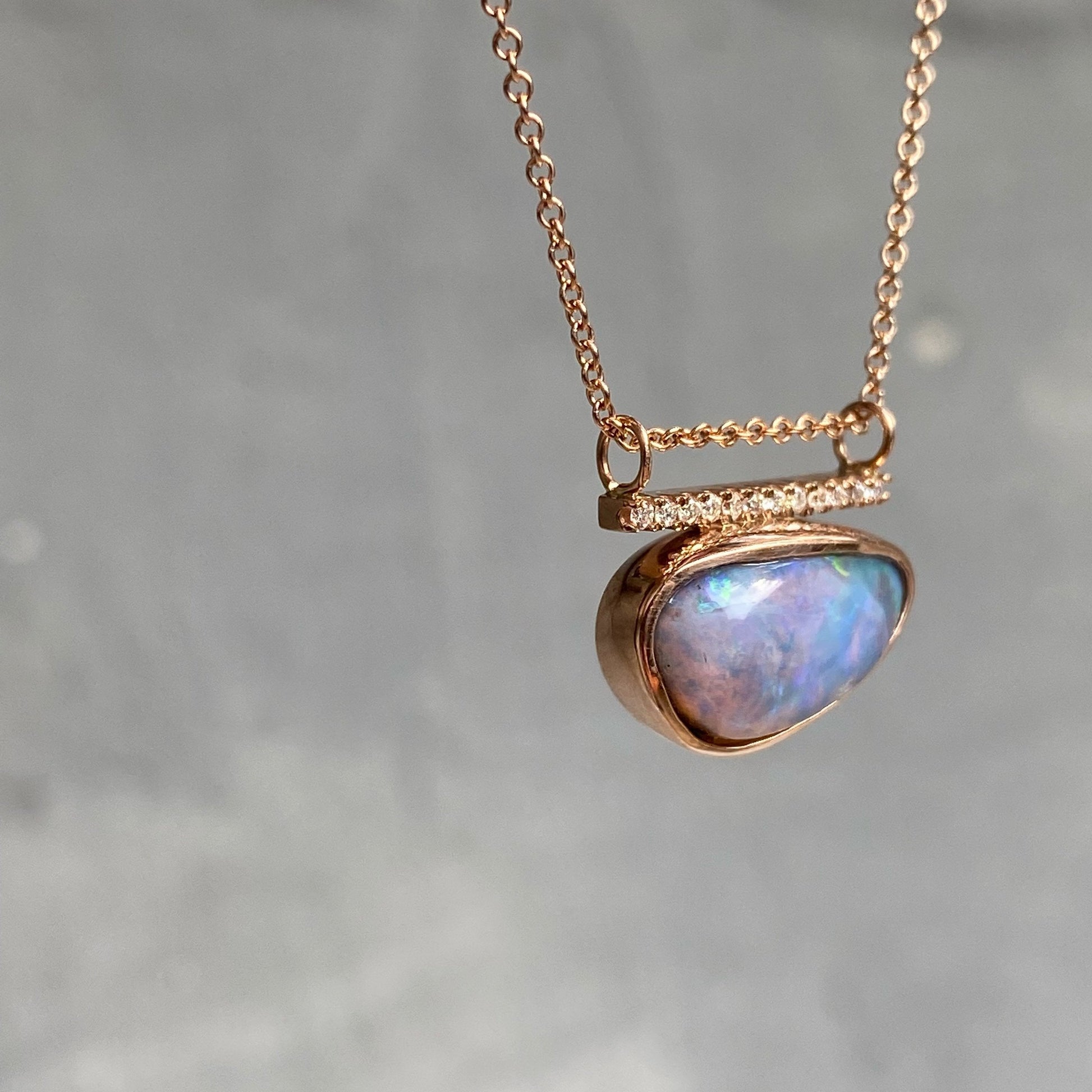 Angle shot of purple opal pendant necklace by NIXIN Jewelry