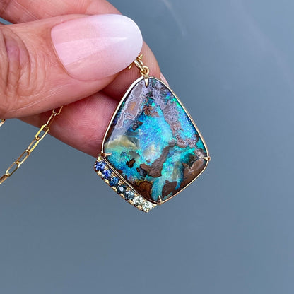 Large Australian Opal pendant by NIXIN Jewelry held in shade