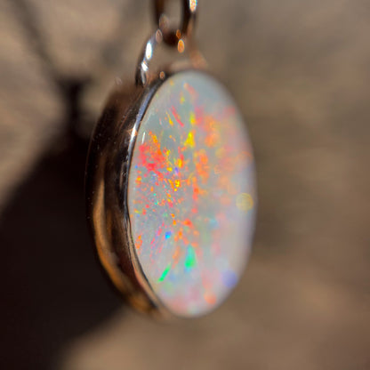 A magnified photo of an Australian Opal Necklace by NIXIN Jewelry. A real opal necklace set in 14k rose gold.