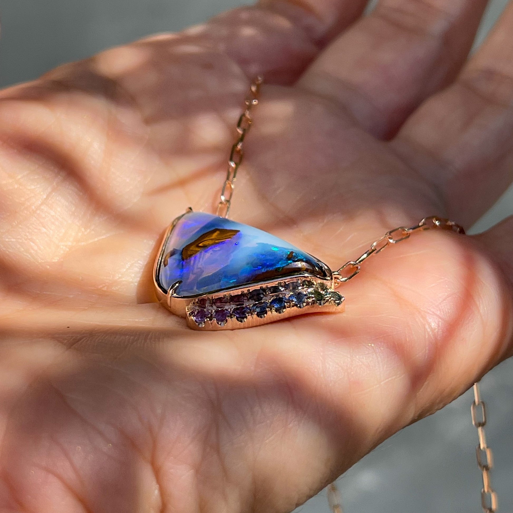 Side view of blue boulder opal necklace with paperclip chain by NIXIN Jewelry