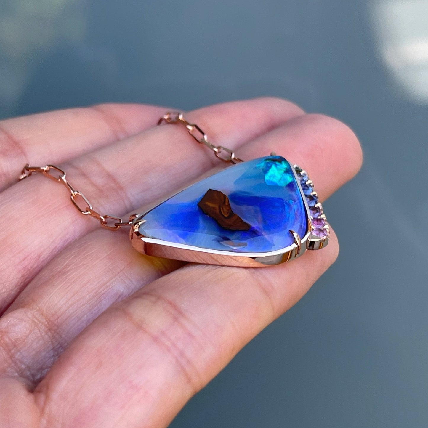 Side view of blue green boulder opal pendant by NIXIN Jewlery