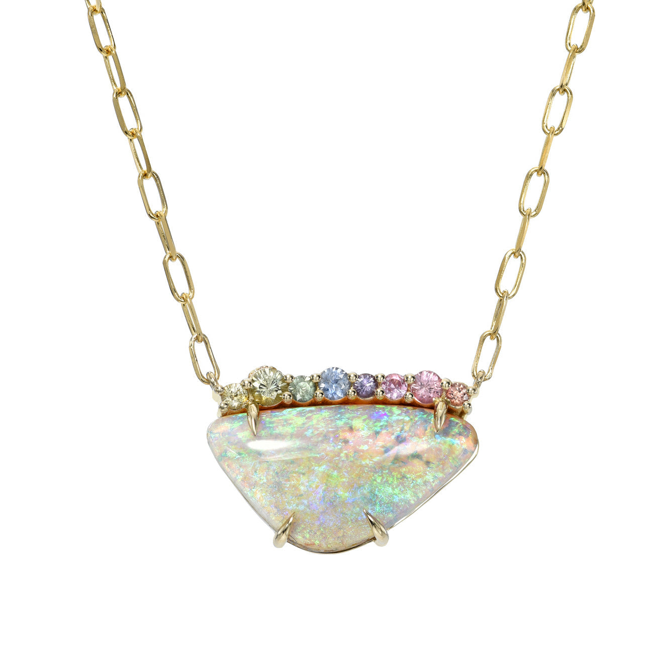 An Australian Opal Necklace by NIXIN Jewelry with a Crystal Opal and sapphires hanging in front of a white backdrop.