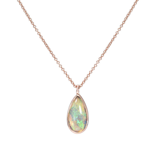 A NIXIN Jewelry Australian Opal Necklace in 14k rose gold hangs in front of a white backdrop.
