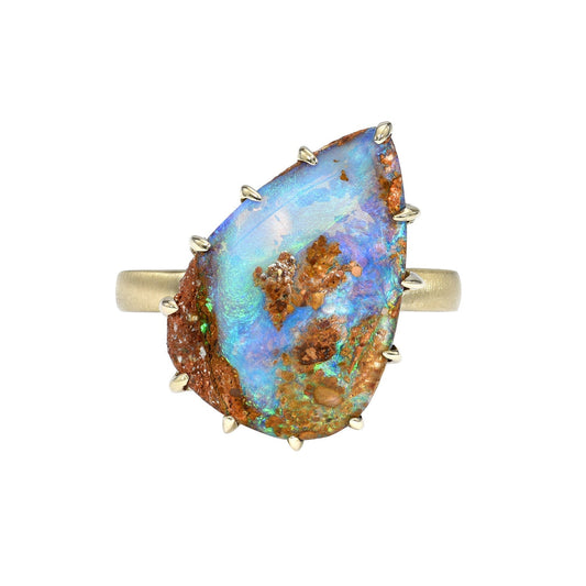 A NIXIN Jewelry Australian Opal Ring against a white backdrop. Made in 14k yellow gold with a Boulder Opal.