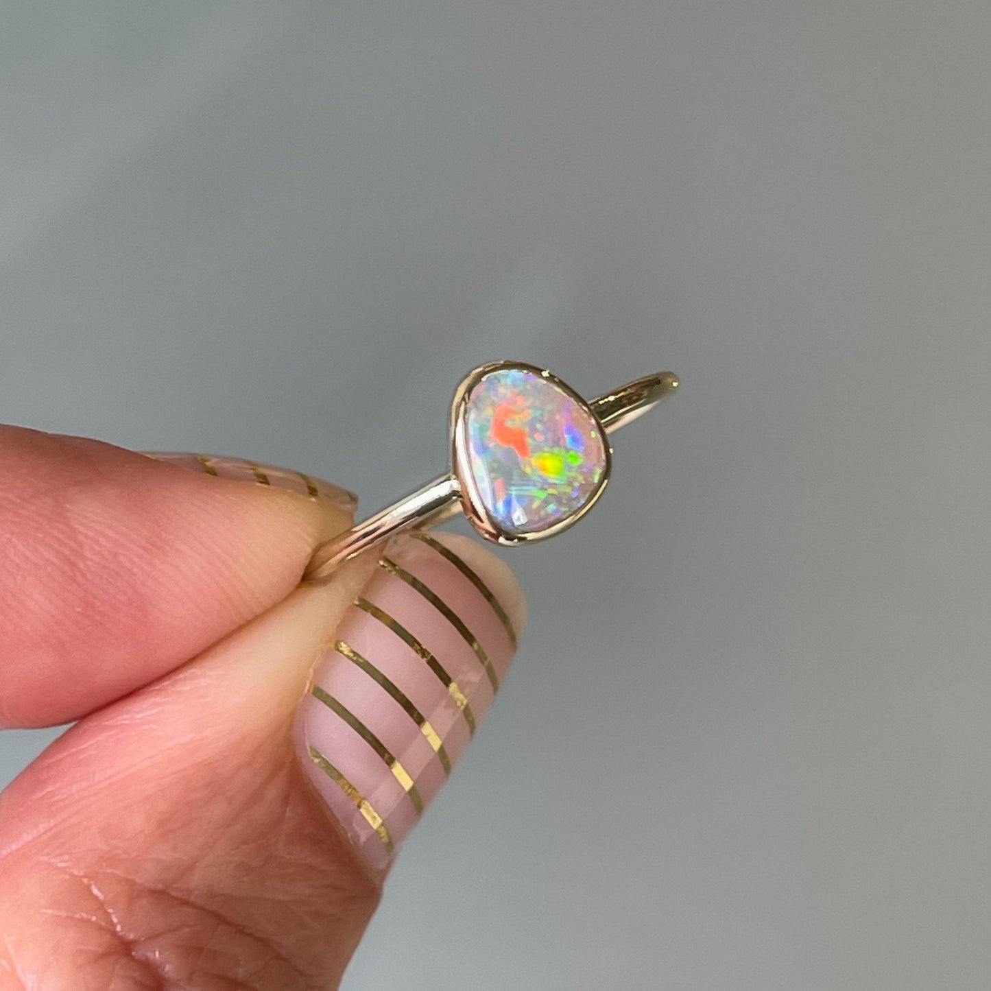 Opal stacking ring in gold by NIXIN Jewelry