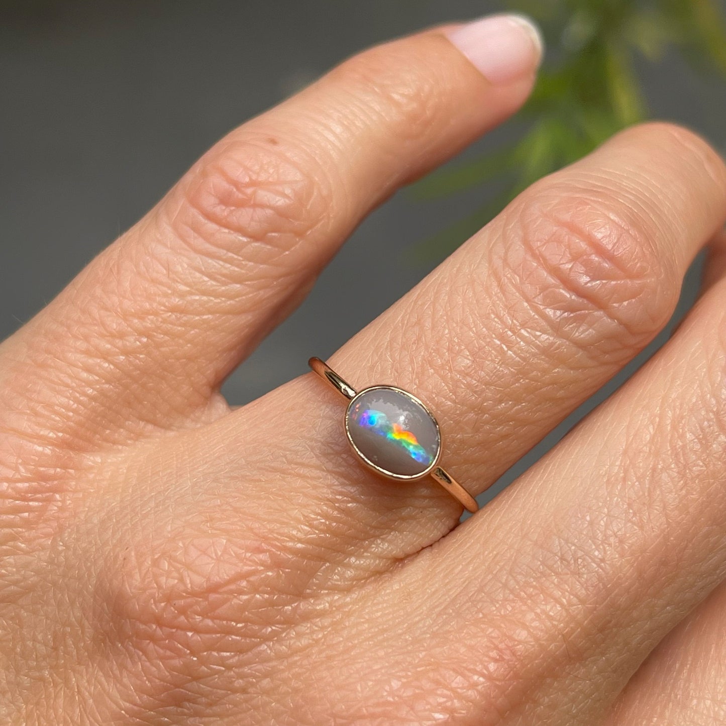 Grey opal ring on hand by NIXIN Jewelry