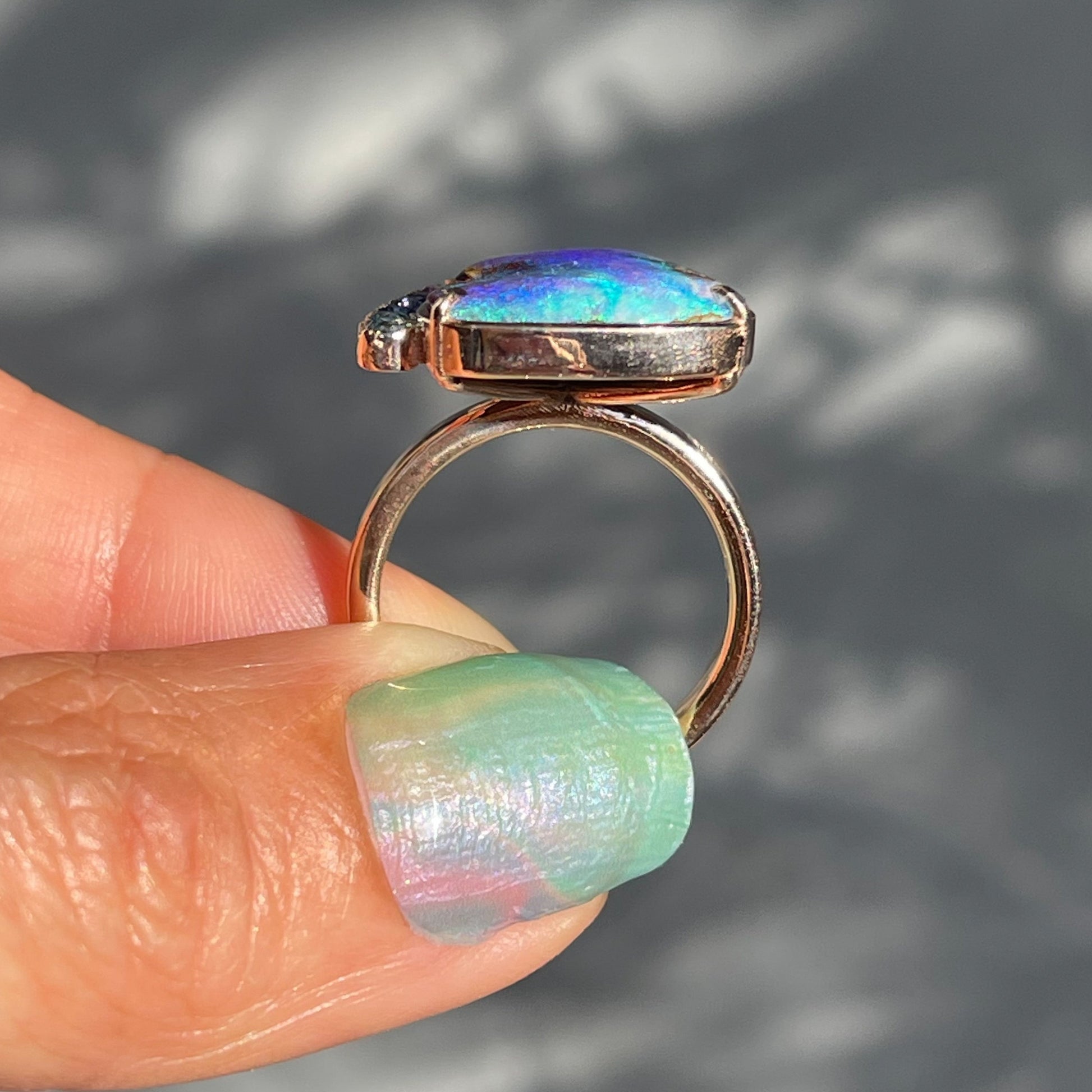 A profile view of an Australian Opal Ring by NIXIN Jewelry. 