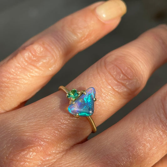Australian opal ring by NIXIN Jewelry modeled on hand