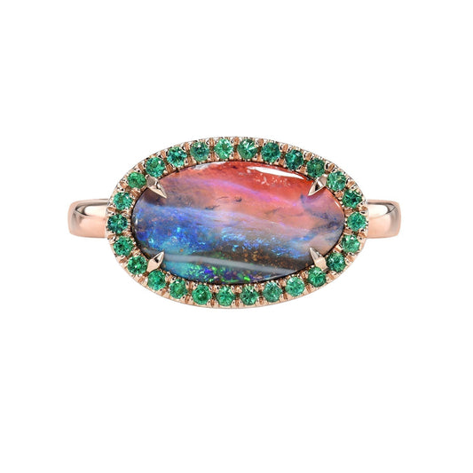 Australian Opal and Emerald Ring by NIXIN Jewelry on white background. Rose gold opal ring.