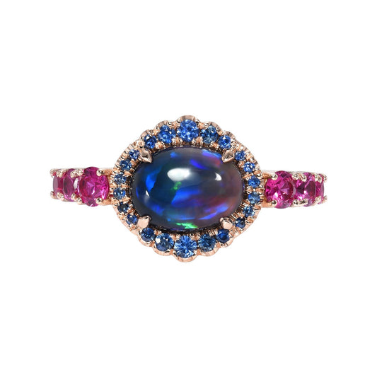 Sapphire and Opal Ring by NIXIN Jewelry on white background. Black opal ring.