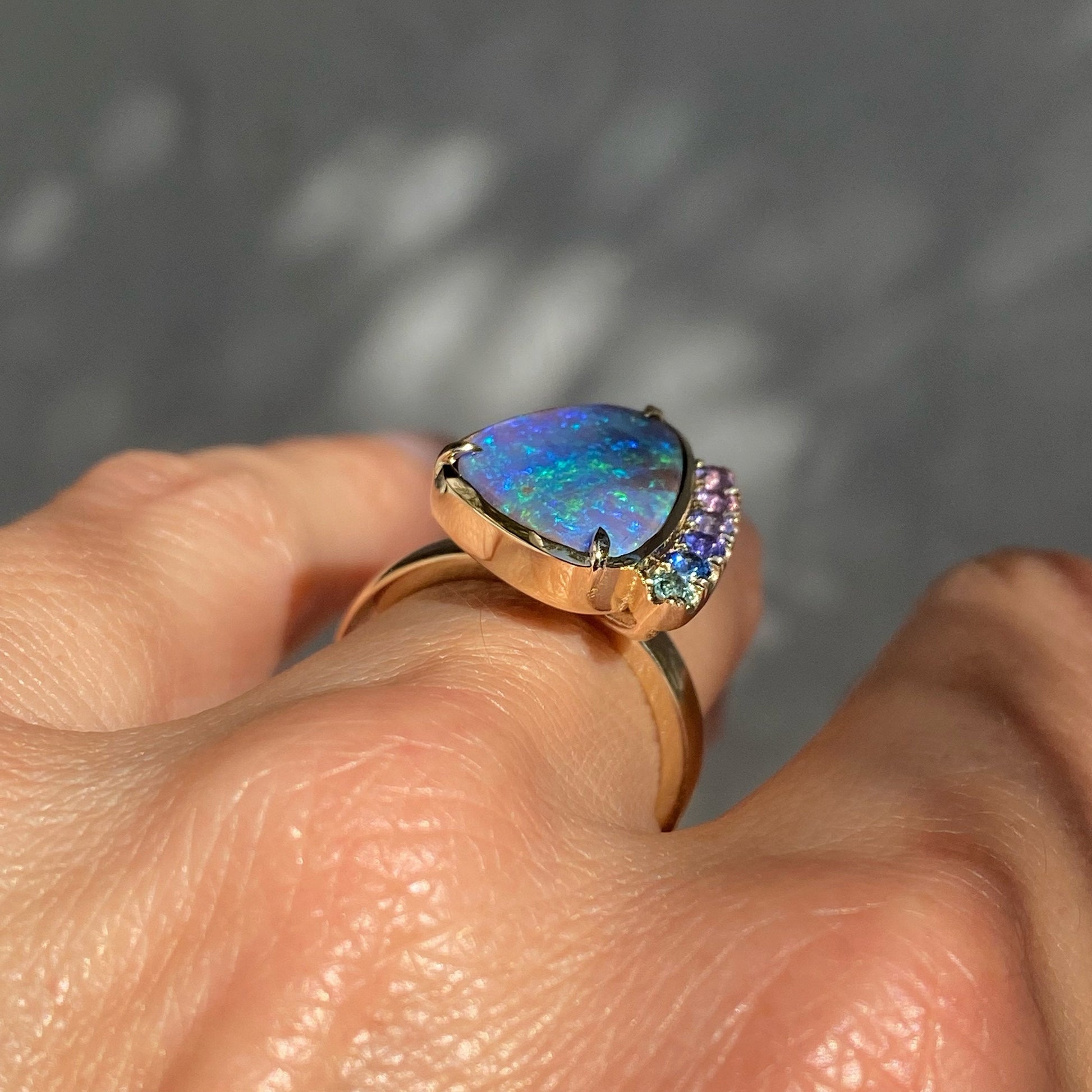 Profile shot of of opal and sapphire ring by NIXIN Jewelry