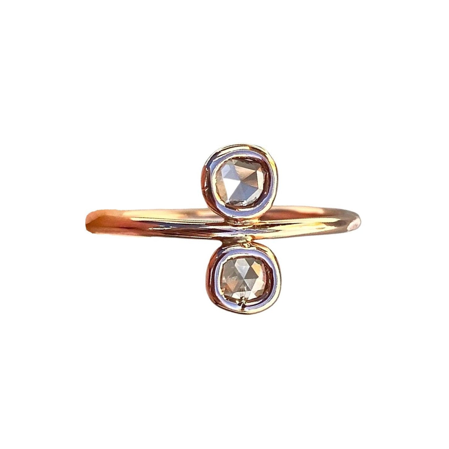 A delicate diamond slice rose gold ring by NIXIN Jewelry is displayed against a white background.