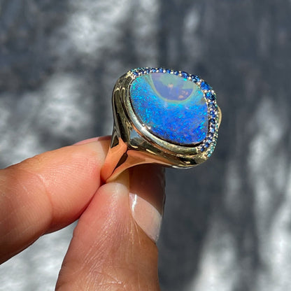 Australian Opal Ring by NIXIN Jewelry shown at angle. Blue green opal ring.