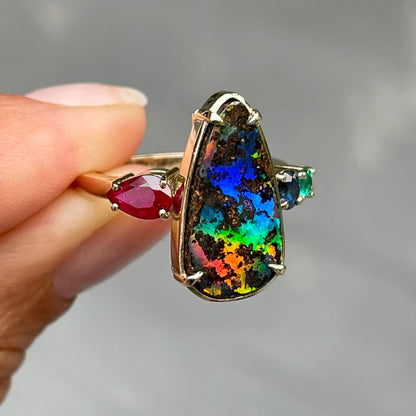 Pear shaped opal ring with rainbow opal and emerald by NIXIN Jewelry