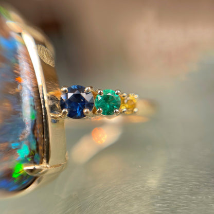 Close up of opal ring with sapphire and emerald shiank - NIXIN Jewelry
