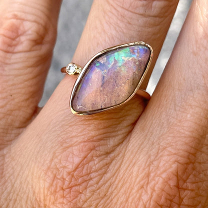 Zion Dali Australian Opal Ring by NIXIN Jewelry modeled on finger in the shade. Real opal ring.
